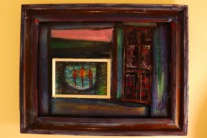 A framed painting by Daniel Pari, which offers a glimpse into a slice of life that can be perceived in very different ways.