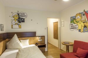 Marcus Trepesch designed the "Bilderbuchbett" single room based on motifs from his own comic book.