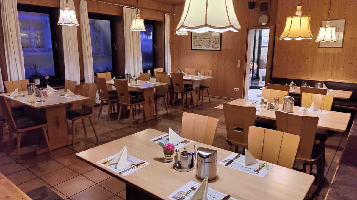 The dining room with set tables in the early morning.